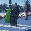 Boy with a sled.